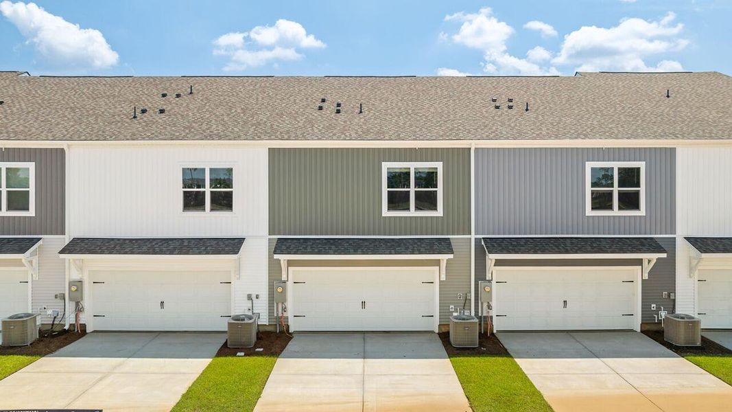 Front exterior of a new home in The Crossing at St. James, Summerville, SC, highlighting curb appeal (Image 2). Front exterior of a new home in The Crossing at St. James, Summerville, SC, highlighting curb appeal (Image 2).