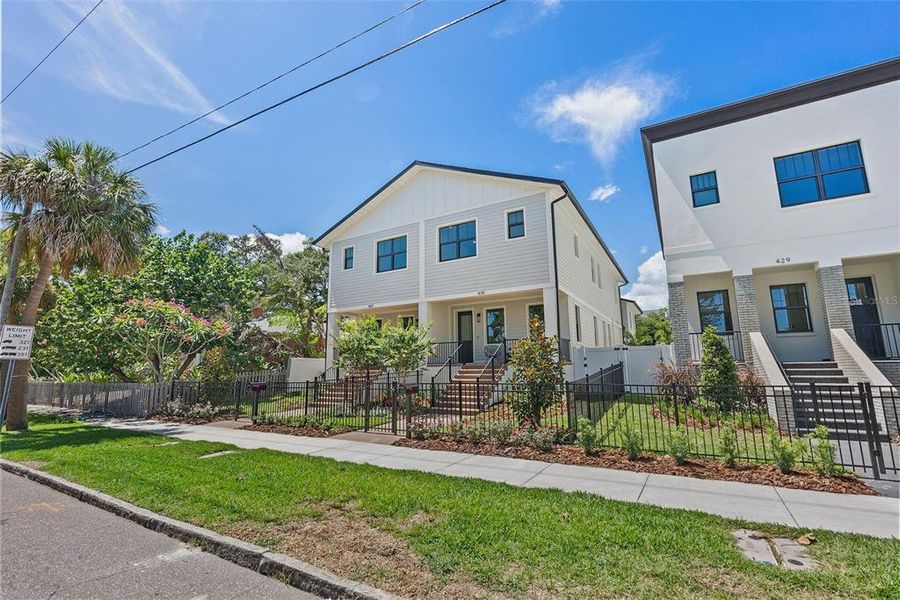 Front exterior of a new home in , St. Petersburg, FL, highlighting curb appeal (Image 2). Front exterior of a new home in , St. Petersburg, FL, highlighting curb appeal (Image 2).