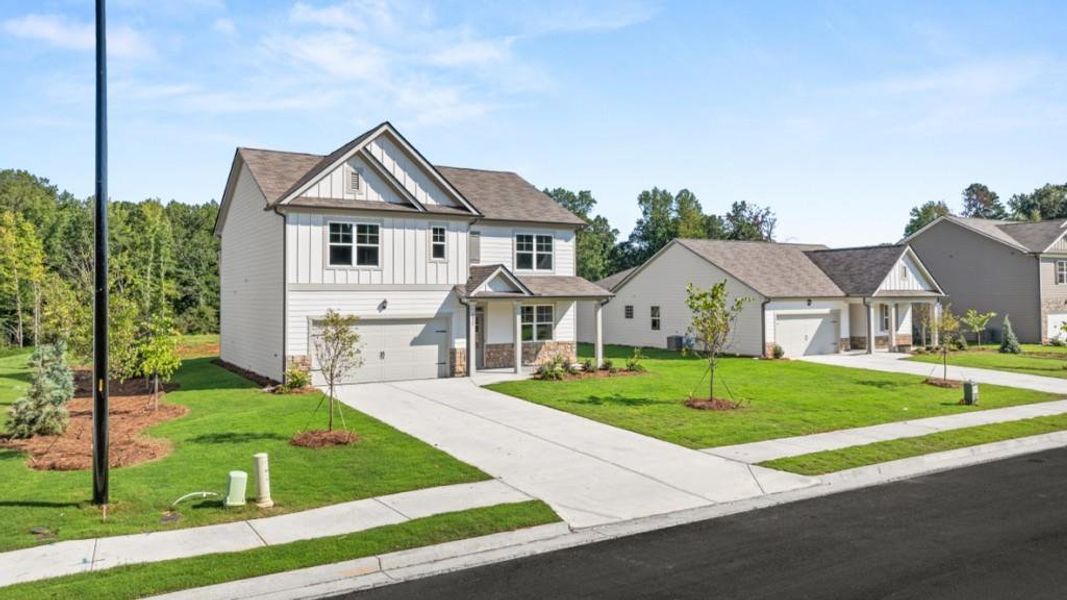 Front exterior of a new home in Fairhaven, Lithia Springs, GA, highlighting curb appeal (Image 28). Front exterior of a new home in Fairhaven, Lithia Springs, GA, highlighting curb appeal (Image 28).
