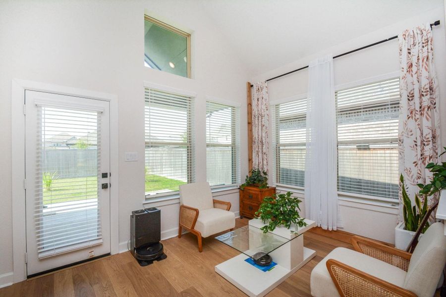 Gracefully positioned to capture abundant natural light, this elegant retreat offers a seamless connection between the home's interior and the backyard beyond. Refined yet inviting, it's a versatile space designed for quiet mornings, meaningful conversations, and moments of everyday tranquility.