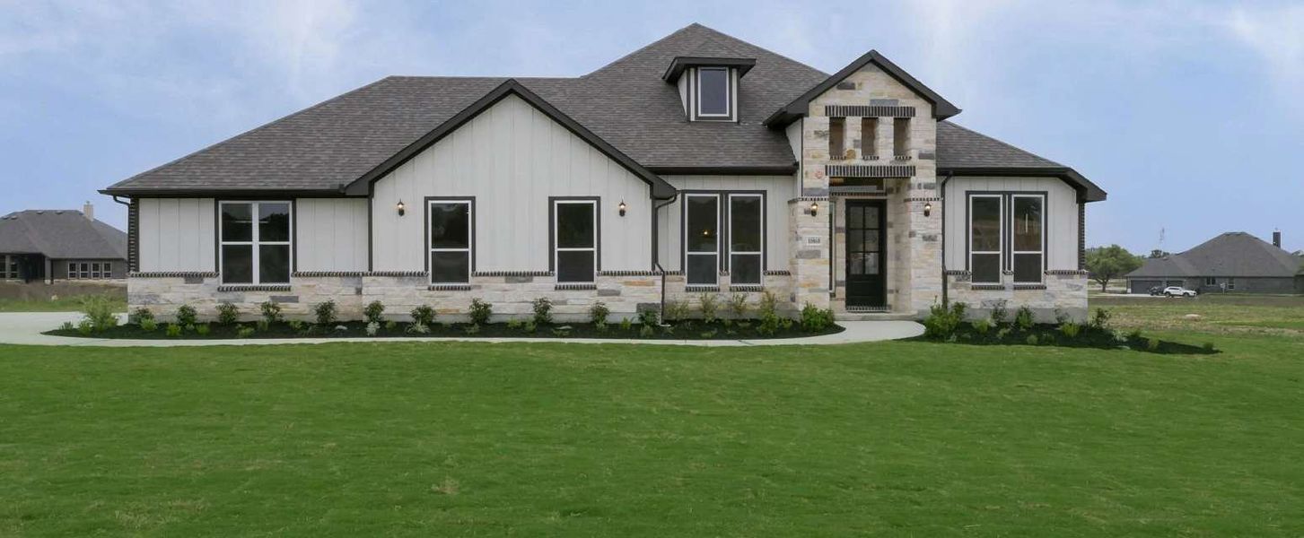 Representative exterior photo of a completed home built from the Avalon II by Ashton Woods in Waldsanger, New Braunfels, TX (Image 12). Representative exterior photo of a completed home built from the Avalon II by Ashton Woods in Waldsanger, New Braunfels, TX (Image 12).