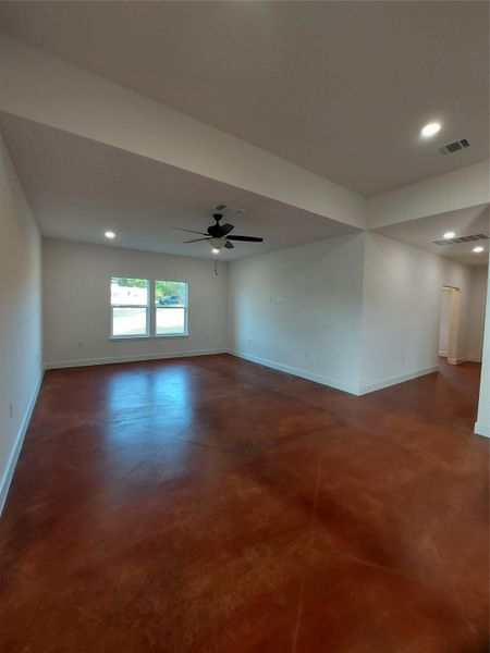 Unfurnished room with concrete floors, recessed lighting, and a ceiling fan