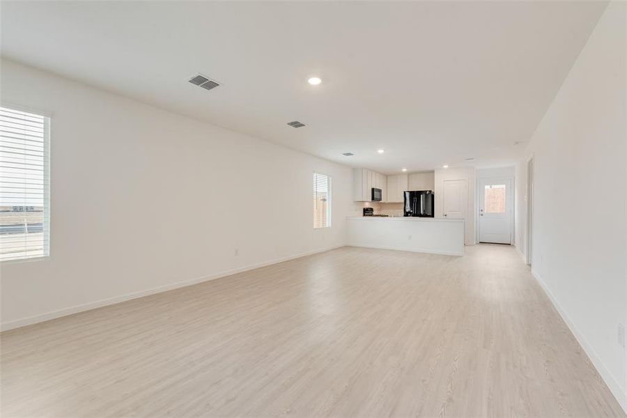 Unfurnished living room featuring light hardwood / wood-style flooring