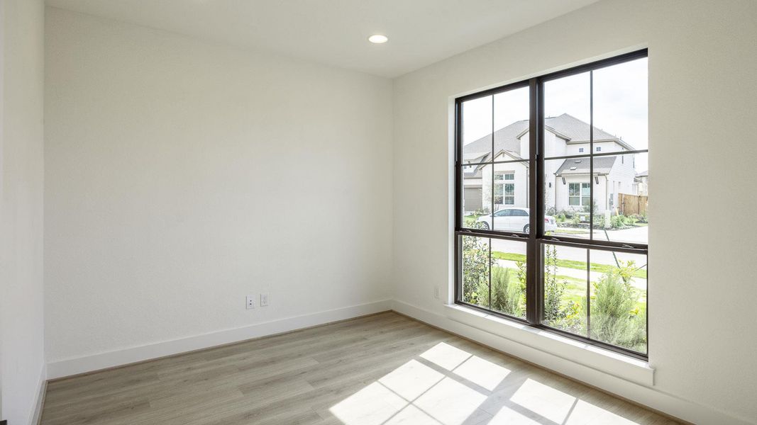 Spare room featuring light wood-style floors and recessed lighting