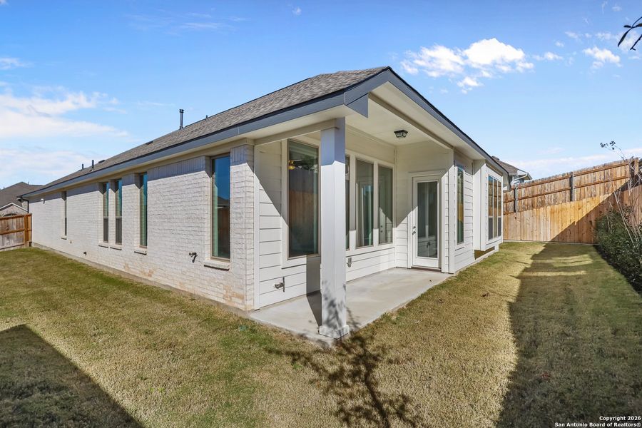 Exterior details and patio area of a home in Homestead 65', Schertz (Image 3).