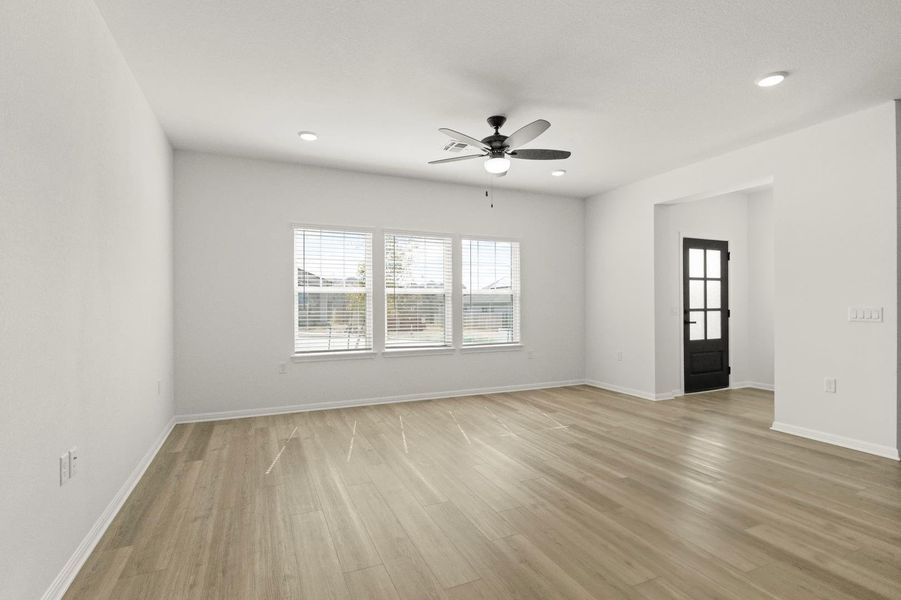 Unfurnished room featuring ceiling fan, light wood-style flooring, and recessed lighting