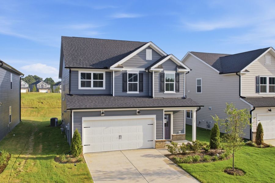 Front exterior of a new home in Providence Oaks, Fuquay Varina, NC, highlighting curb appeal (Image 24). Front exterior of a new home in Providence Oaks, Fuquay Varina, NC, highlighting curb appeal (Image 24).