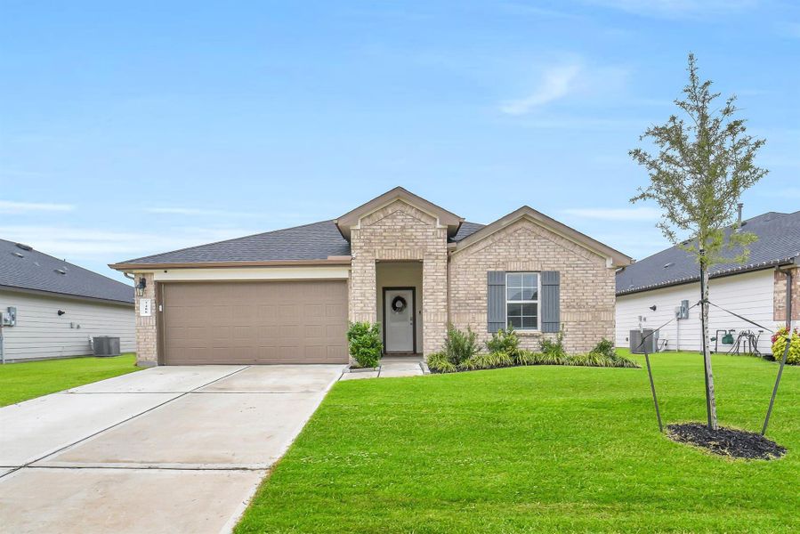 Front exterior of a new home in , Richmond, TX, highlighting curb appeal (Image 1).