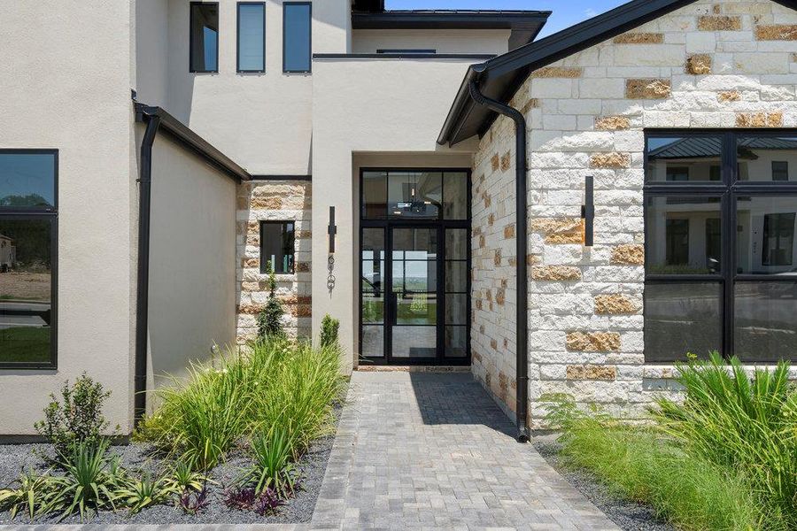 Exterior details and patio area of a home in Milky Way at River Place, Austin (Image 4).