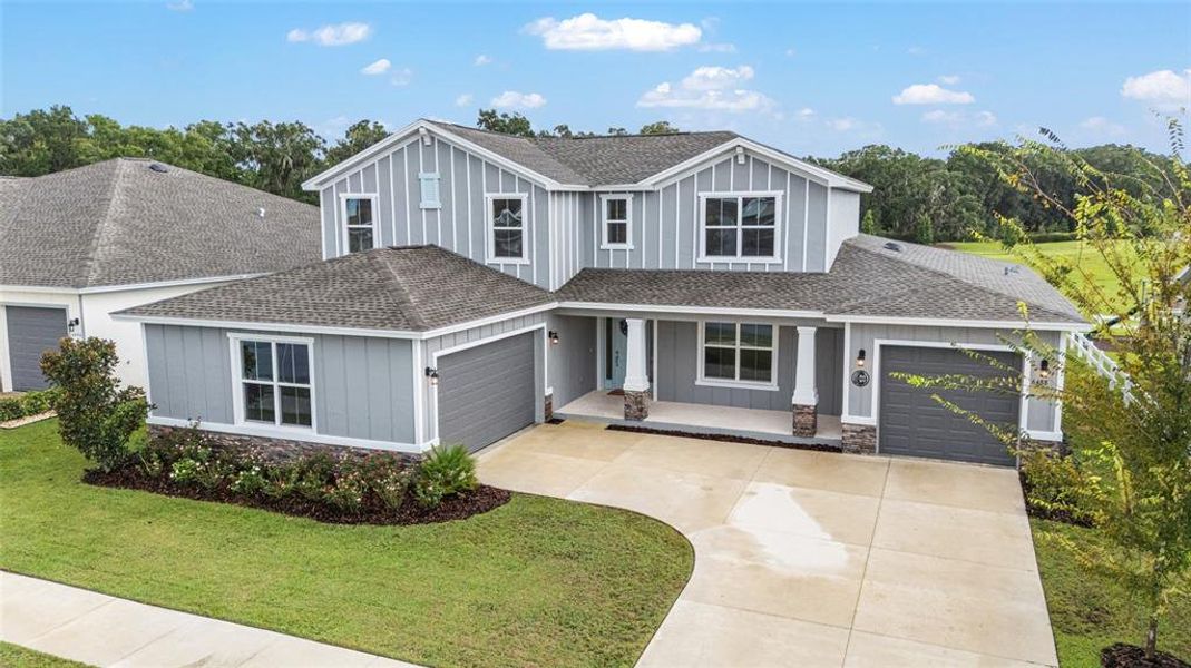 Front exterior of a new home in Calesa Township, Ocala, FL, highlighting curb appeal (Image 23).