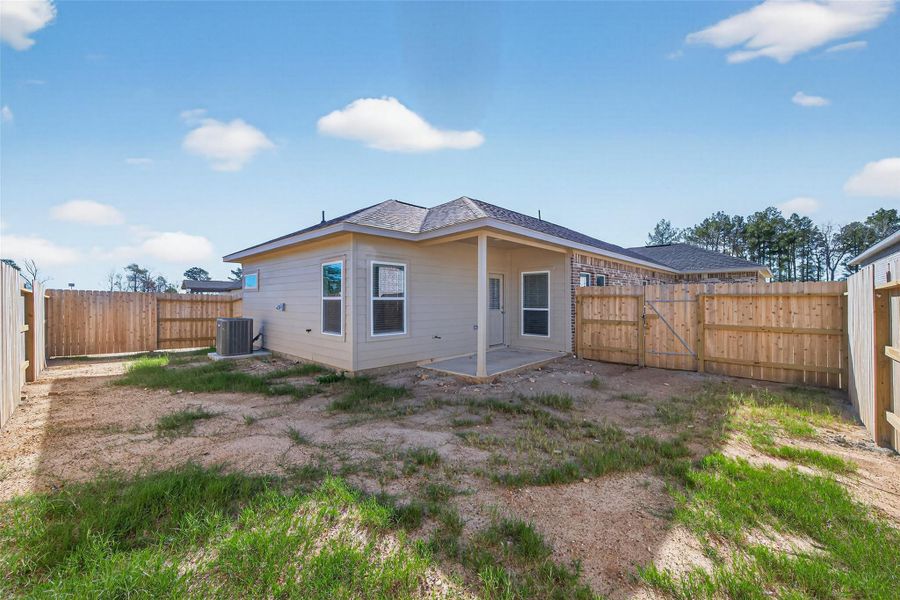 Exterior details and patio area of a home in Enclave at Willis, Willis (Image 21).