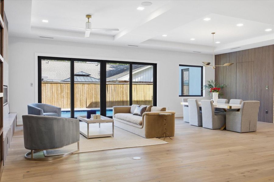 Soaring ceilings and subtle architectural detailing enhance the sense of volume, creating an atmosphere that feels both open and intentional.