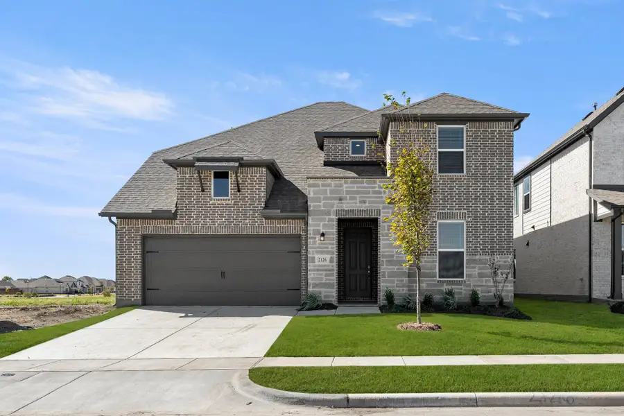 Representative exterior photo of a completed home built from the Hero by Rockwell Homes in Creekside, Royse City, TX (Image 1). Representative exterior photo of a completed home built from the Hero by Rockwell Homes in Creekside, Royse City, TX (Image 1).