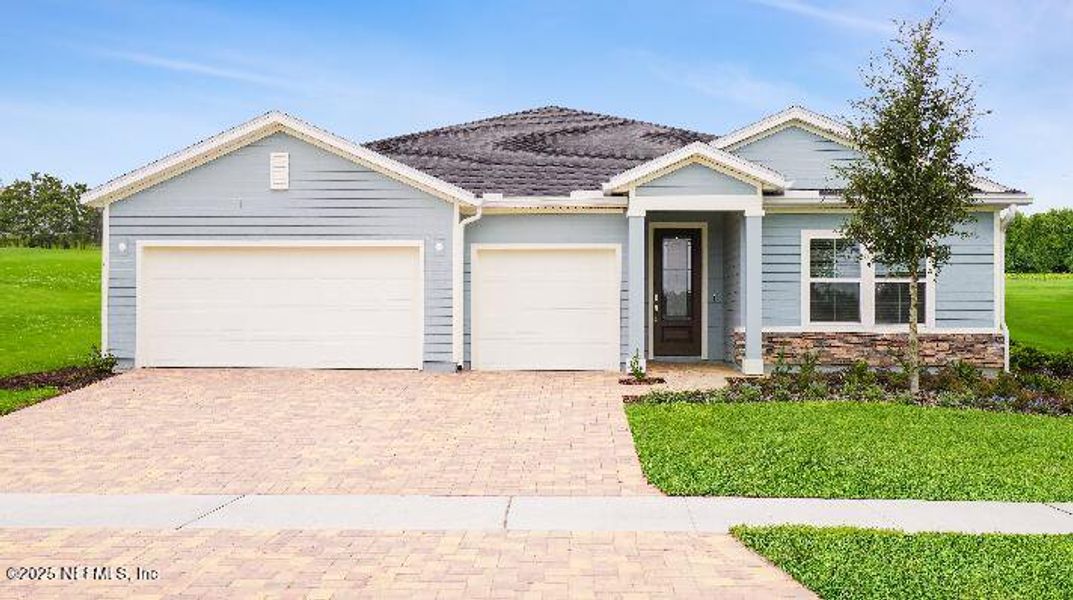 Front exterior of a new home in Tributary: Tributary Royal Collection, Yulee, FL, highlighting curb appeal (Image 1).
