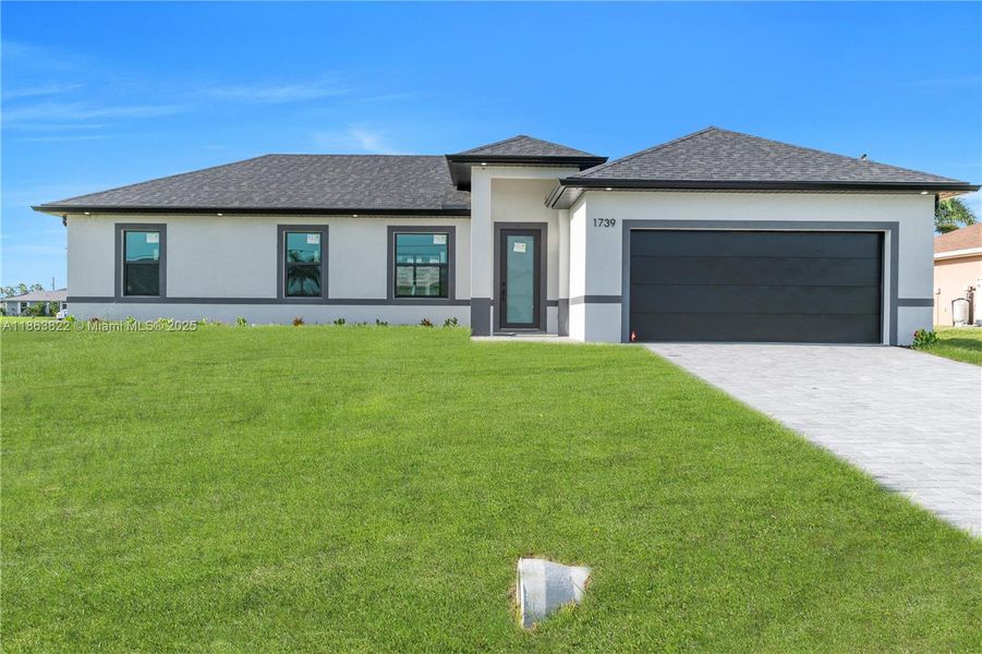 Front exterior of a new home in , Cape Coral, FL, highlighting curb appeal (Image 2). Front exterior of a new home in , Cape Coral, FL, highlighting curb appeal (Image 2).