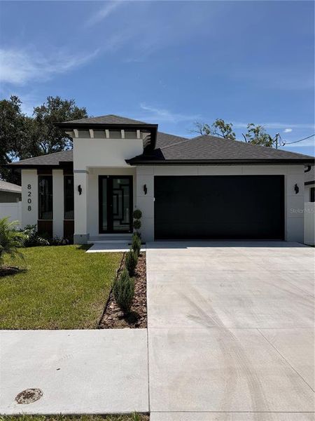 Front exterior of a new home in , Tampa, FL, highlighting curb appeal (Image 23).
