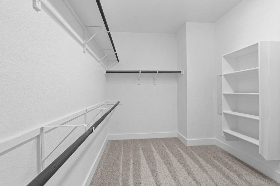 Walk-in closet in Primary Bedroom Walk-in closet in Primary Bedroom
