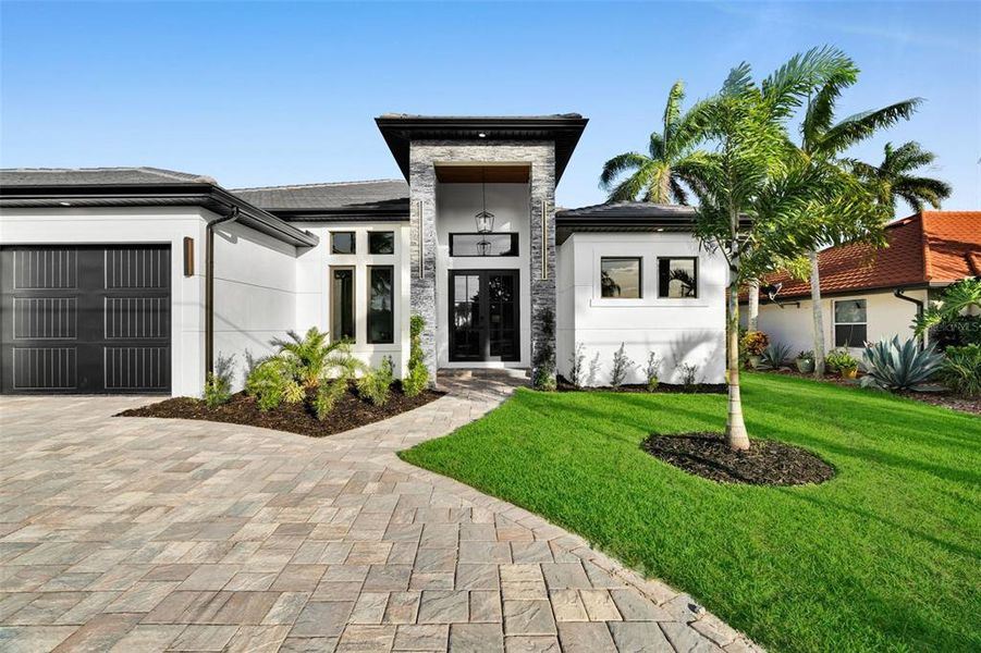Front exterior of a new home in , Cape Coral, FL, highlighting curb appeal (Image 23).