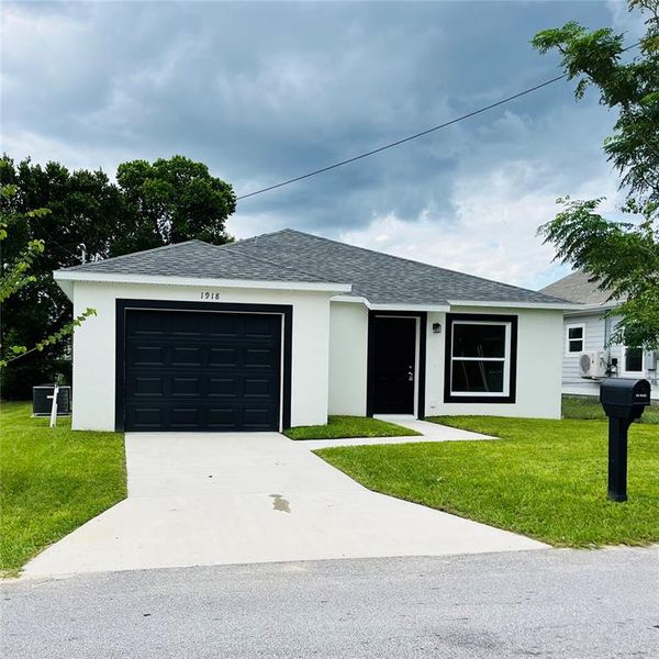 Front exterior of a new home in , Haines City, FL, highlighting curb appeal (Image 9). Front exterior of a new home in , Haines City, FL, highlighting curb appeal (Image 9).