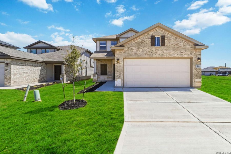 Front exterior of a new home in Katzer Ranch, Converse, TX, highlighting curb appeal (Image 2). Front exterior of a new home in Katzer Ranch, Converse, TX, highlighting curb appeal (Image 2).