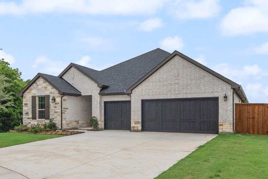 Front exterior of a new home in Valencia On The Lake, Little Elm, TX, highlighting curb appeal (Image 19).