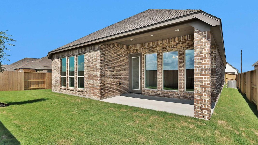 Exterior details and patio area of a home in Meridiana, Manvel (Image 2).