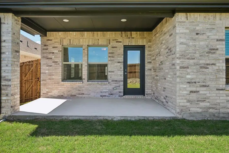 Exterior details and patio area of a home in Parks at Foster Crossing - Spring Series, Anna (Image 4).