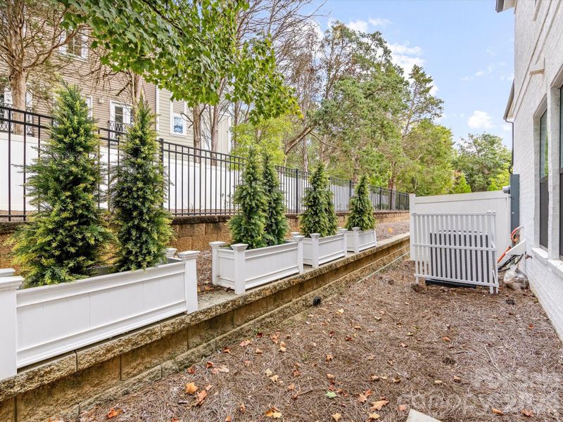 Exterior details and patio area of a home in Towns at Rea Colony, Charlotte (Image 24).