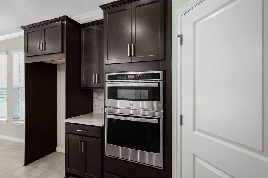 Furnished interior view inside a new home in Veranda Oaks, Port St. Lucie (Image 9).