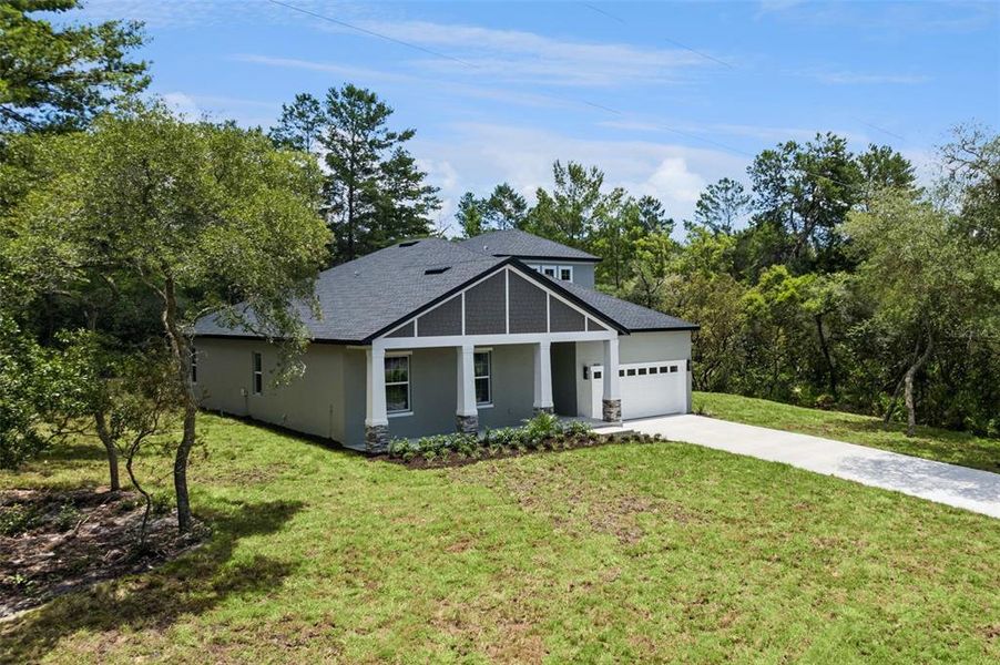 Front exterior of a new home in , Eustis, FL, highlighting curb appeal (Image 1). Front exterior of a new home in , Eustis, FL, highlighting curb appeal (Image 1).