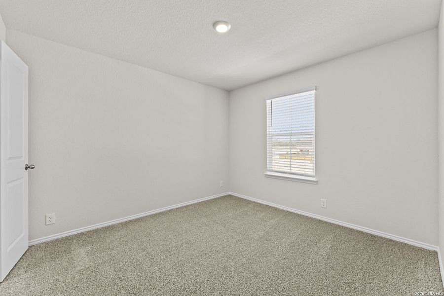 Spacious, unfurnished interior of a new home in Hunters Ranch, San Antonio (Image 19).