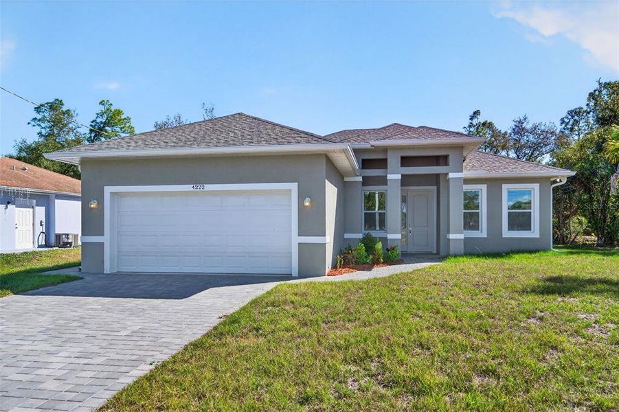 Front exterior of a new home in , North Port, FL, highlighting curb appeal (Image 1). Front exterior of a new home in , North Port, FL, highlighting curb appeal (Image 1).
