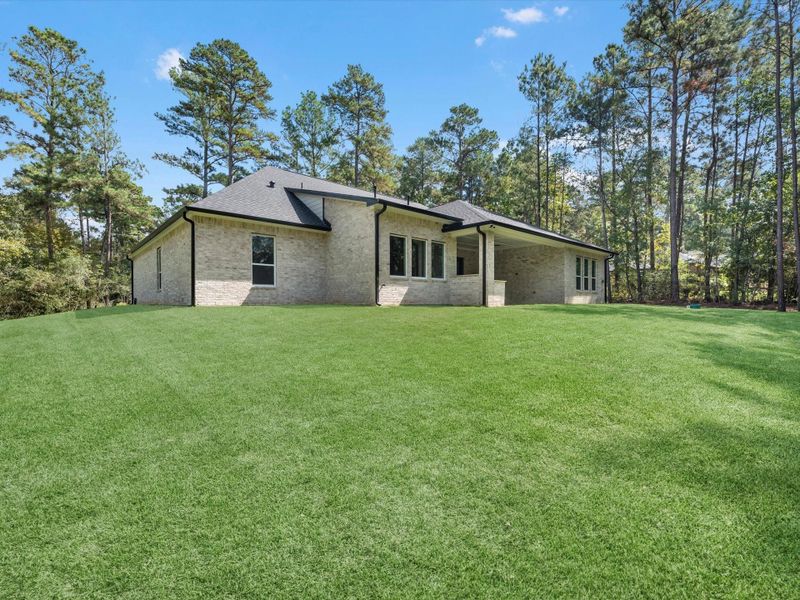 Exterior details and patio area of a home in , New Waverly (Image 3). Exterior details and patio area of a home in , New Waverly (Image 3).