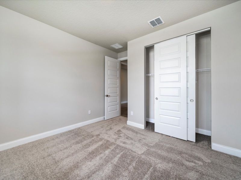 Bedroom in the Onyx floorplan at 6383 NW Sweetwood Drive in Brystol at Wylder