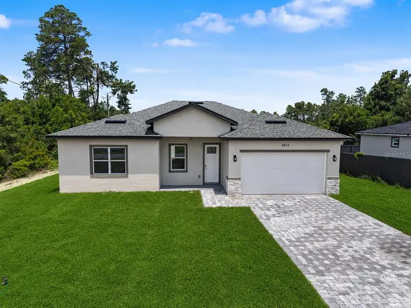 Front exterior of a new home in , Ocala, FL, highlighting curb appeal (Image 21).