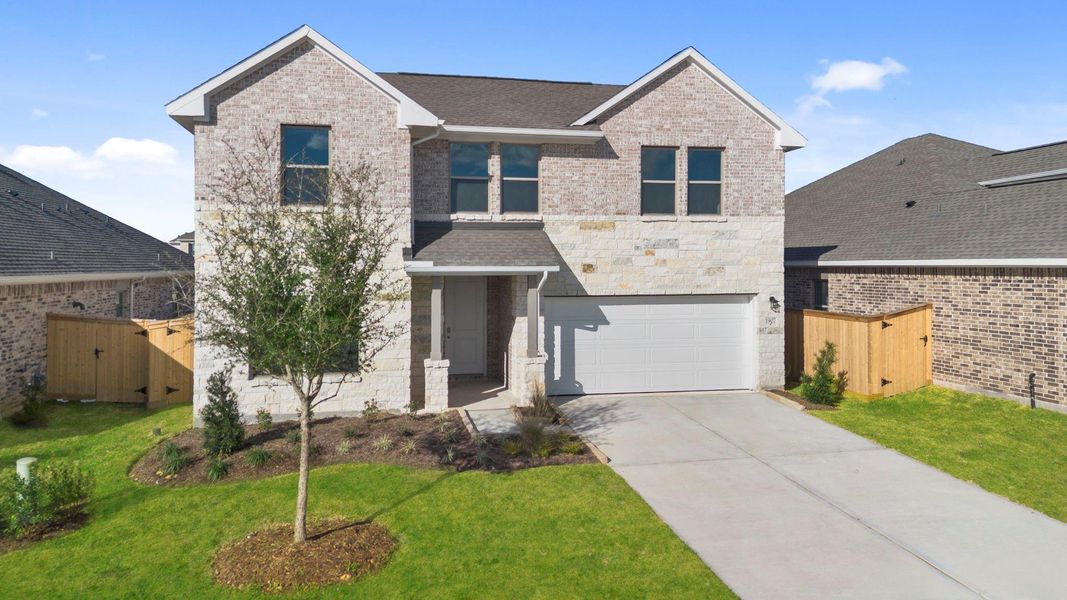 Front exterior of a new home in Windrose Green, Angleton, TX, highlighting curb appeal (Image 20).
