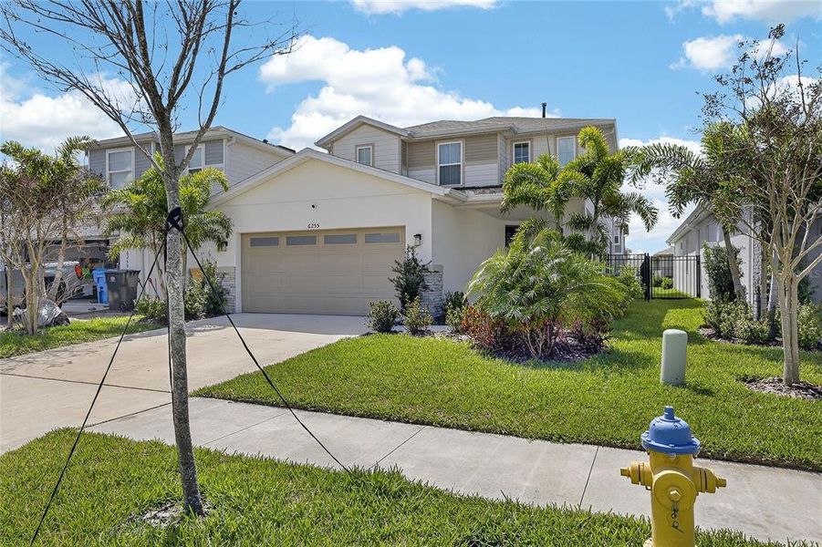 Front exterior of a new home in , Apollo Beach, FL, highlighting curb appeal (Image 26).