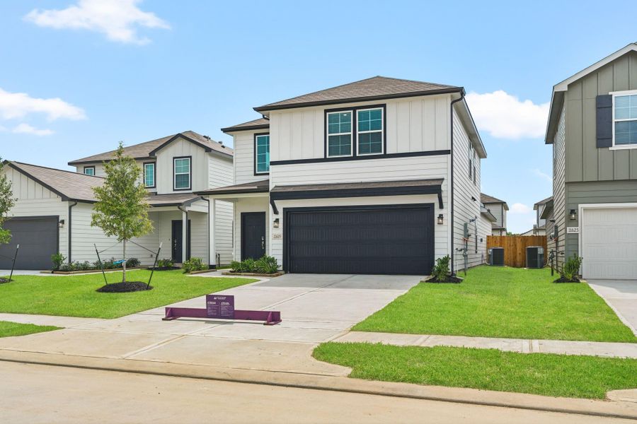 Front exterior of a new home in Barrett Crossing, Crosby, TX, highlighting curb appeal (Image 17). Front exterior of a new home in Barrett Crossing, Crosby, TX, highlighting curb appeal (Image 17).
