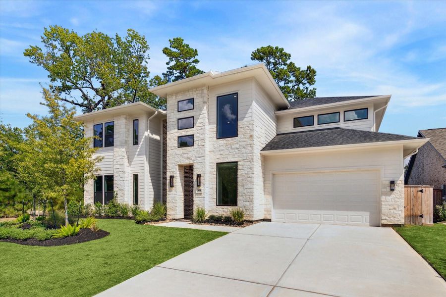 Modern-inspired 2- Story home with 5 Bedrooms, 4.1 Baths, and a 3- Car Tandem Garage.