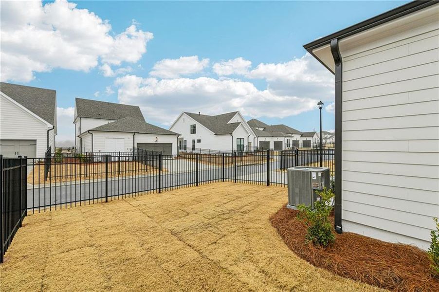Exterior details and patio area of a home in Promenade at Sawnee Village, Cumming (Image 3).