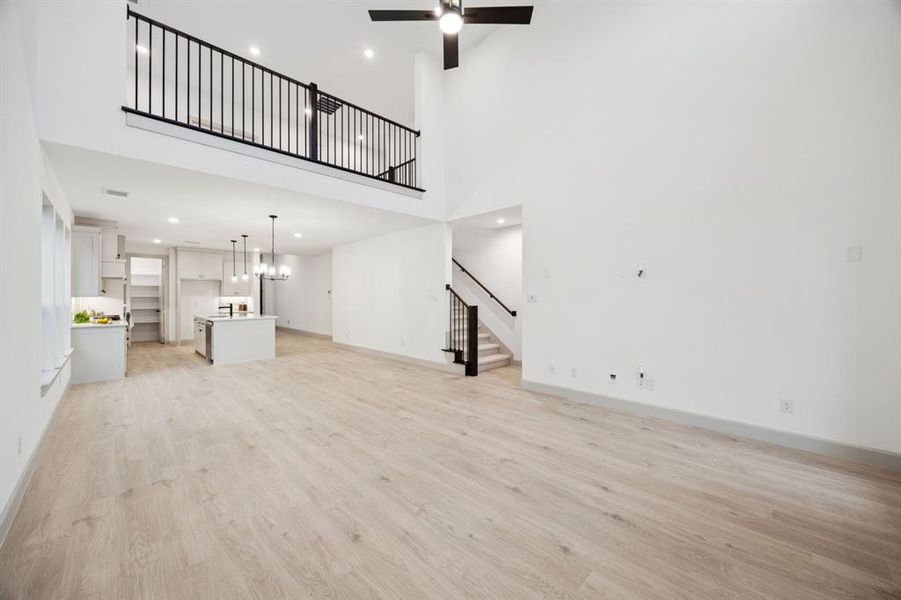 The game room features open railing overlooking the family room creating a multi-story entertaining space!