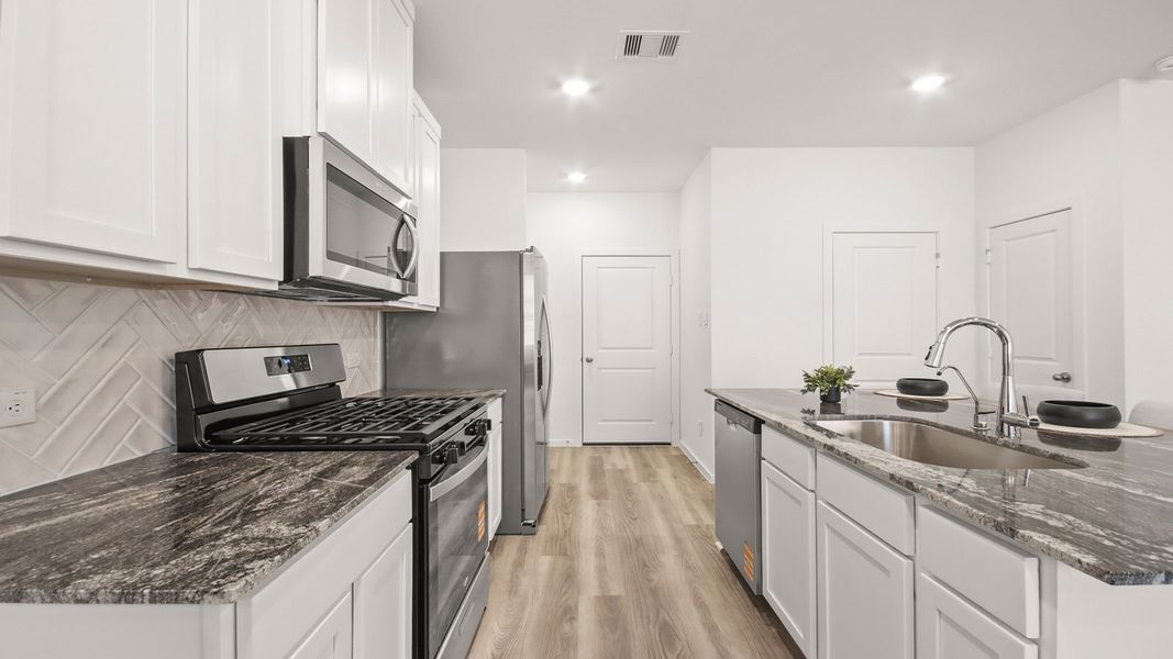 Representative furnished interior of a home built from the 1293 by D.R. Horton in Bridges on Lake Houston Villas, Humble (Image 7).