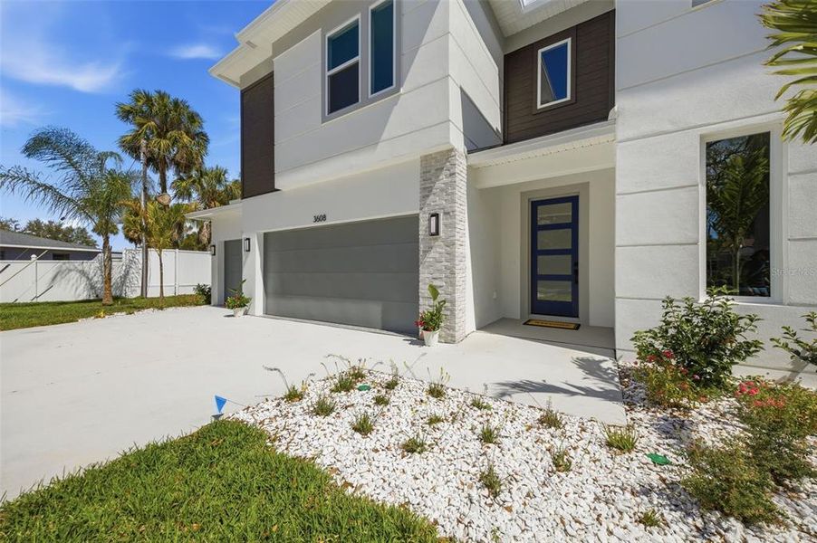 Front exterior of a new home in , Tampa, FL, highlighting curb appeal (Image 28).