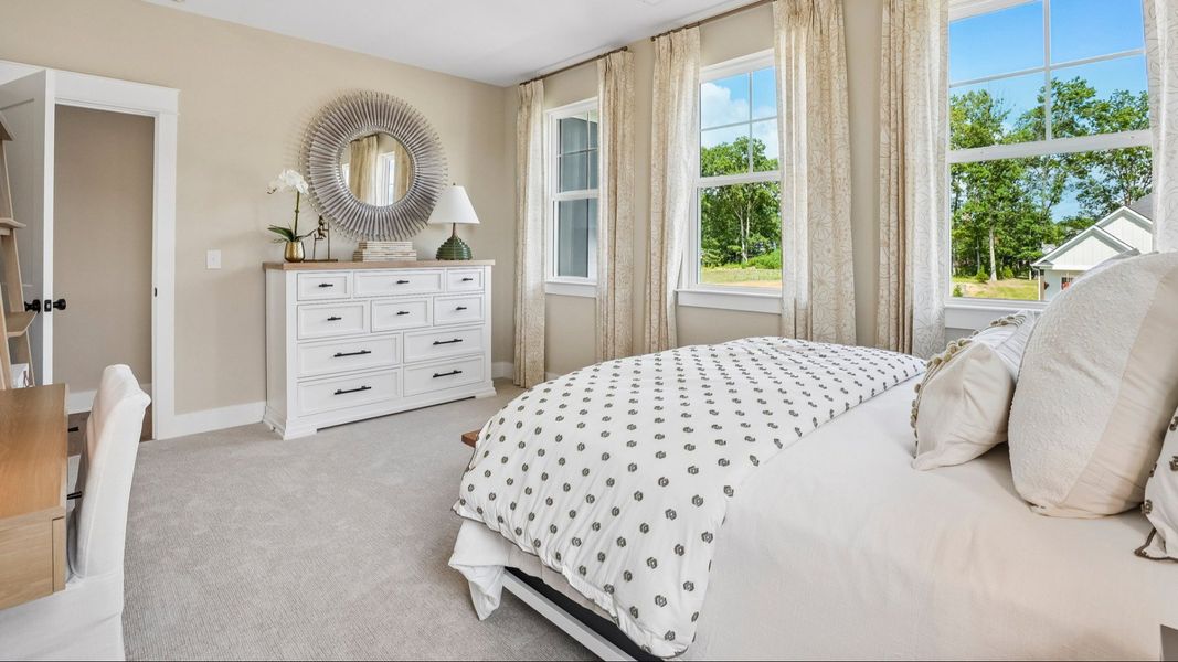 Secondary bedroom with carpet and windows Secondary bedroom with carpet and windows