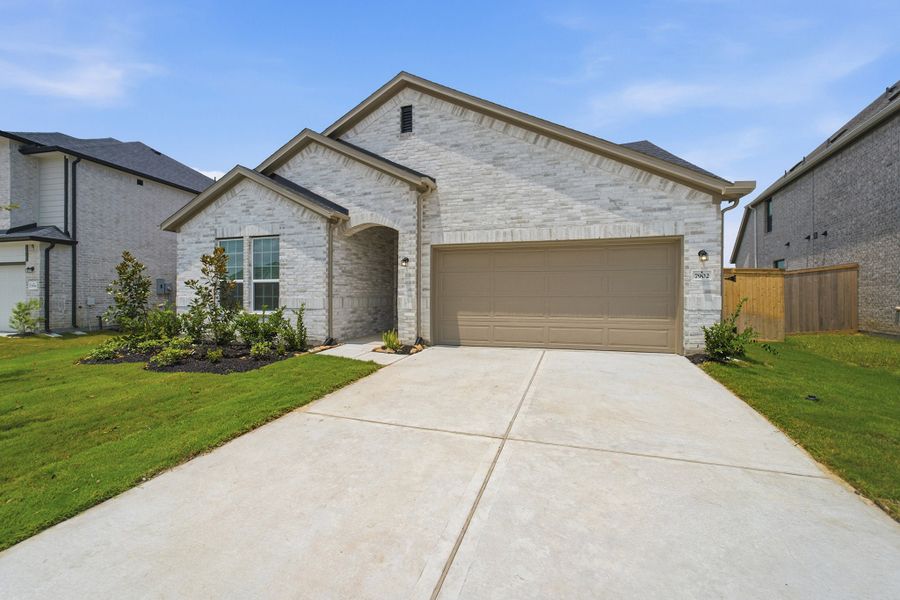 Front exterior of a new home in Ashland, Angleton, TX, highlighting curb appeal (Image 2).