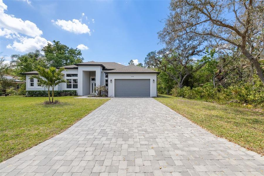 Front exterior of a new home in , Kissimmee, FL, highlighting curb appeal (Image 27). Front exterior of a new home in , Kissimmee, FL, highlighting curb appeal (Image 27).