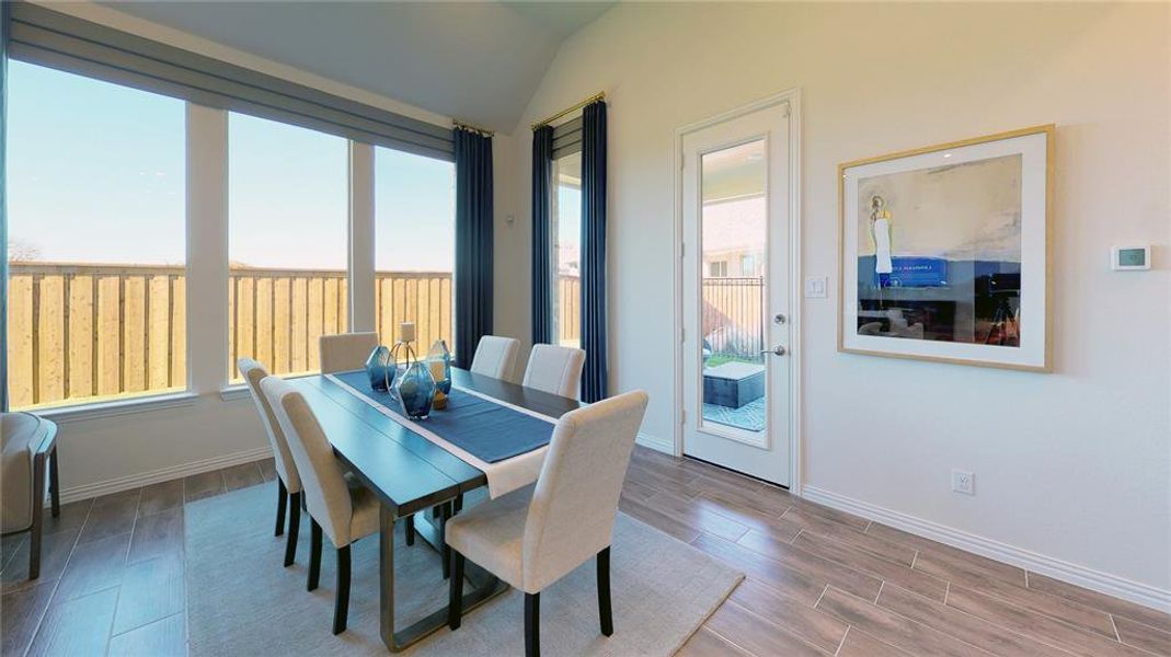 Dining space featuring wood finish floors