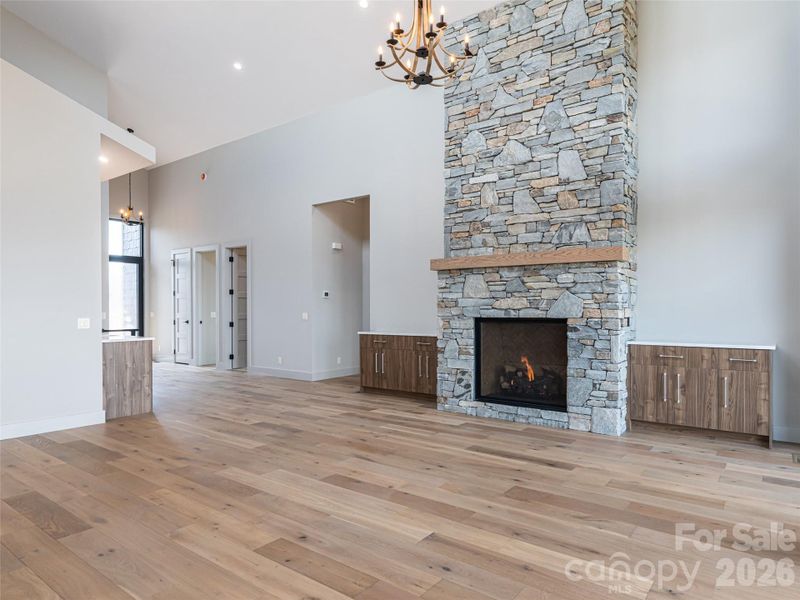 Family Room with Floor to Ceiling Stacked Stone Natural Gas Fireplace