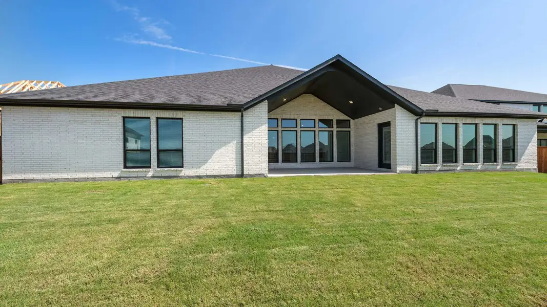 Exterior details and patio area of a home in Creek of Driftwood, Driftwood (Image 3).
