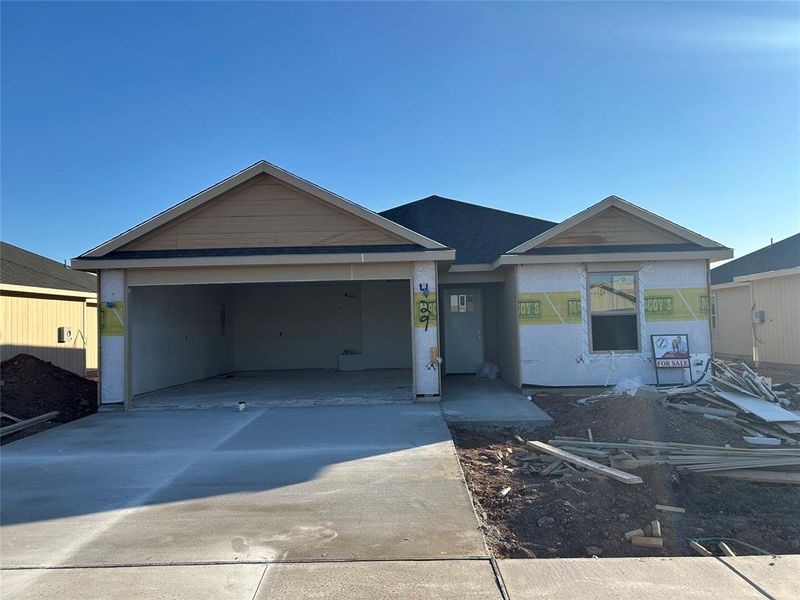 View of front facade featuring concrete driveway